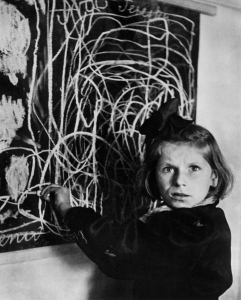 Image of a girl in front of a drawing