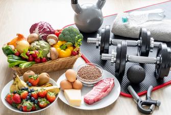 Photo of healthy food and exercise equipment 